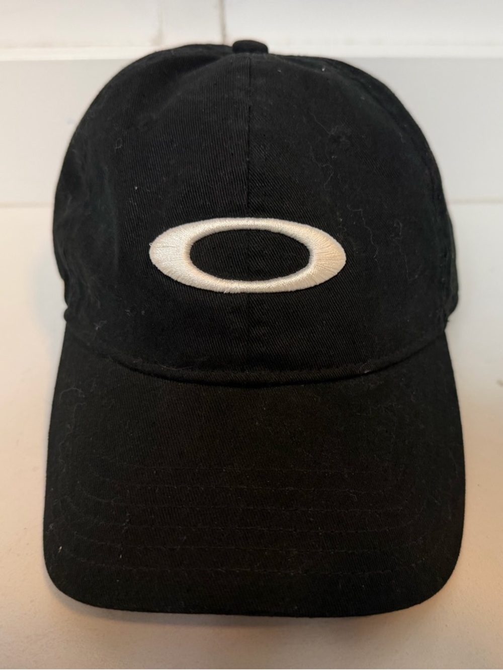 Oakley Ellipse Remix Dad Golf Hat Black & White Strap Back Side Spell Out
